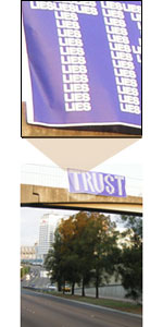 TRUST Banner over bridge spelt using small lies
